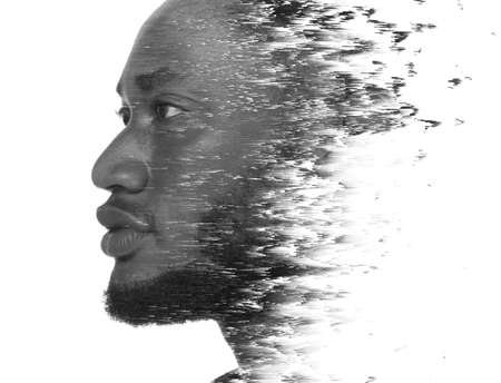 A double exposure portrait of a man combined with digital art.の写真素材