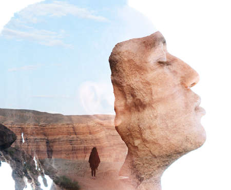 Double exposure portrait of a man combined with rocky landscapeの写真素材