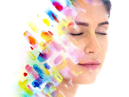 Paintography. Watercolor painting combined with a serene portrait of a womanの写真素材