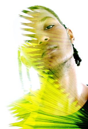 Double exposure portrait of a young man looking into the cameraの写真素材