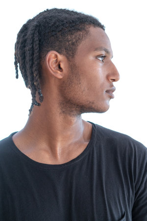 A portrait of a stylish young man with dreadlocksの写真素材