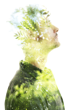 Surreal combination of a portrait and natureの写真素材