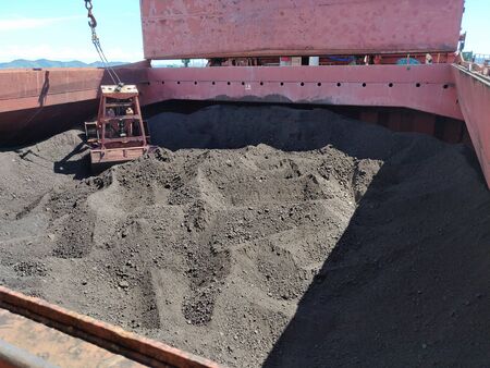 Coal discharging operation on bulk ship.