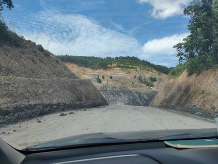 Dirty road to mining site, countryside.