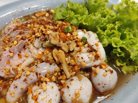 Noodles and fish ball with Tom Yum soup.