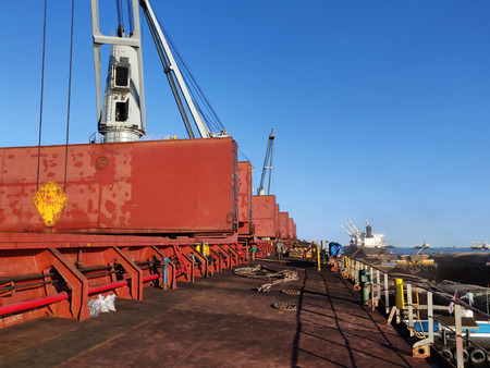 Discharging or loading operation on bulk ship.