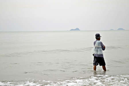 Fisher went to the beach, Hua Hin, Thailand の写真素材