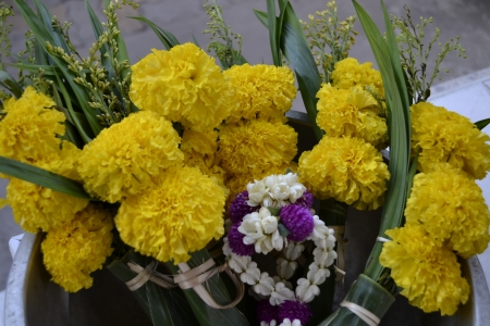 Marigold flowers and garlands for worship の写真素材