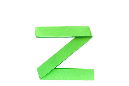 green paper is folded as a letterの写真素材