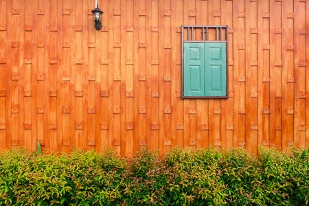 thai styly wall with window and treesの写真素材