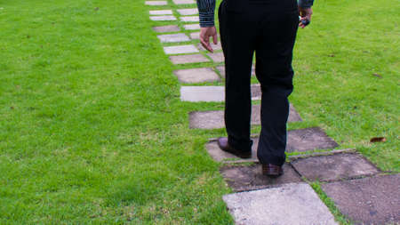 a man is walking on the fieldの写真素材