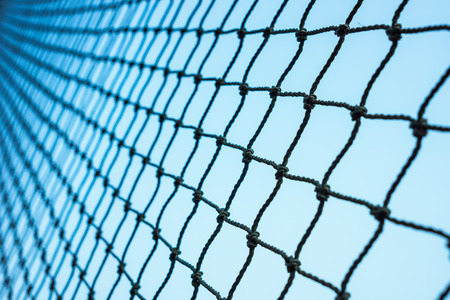 black rope net with blue backgroundの写真素材