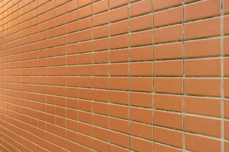 orange brick wall in perspective composition viewの写真素材
