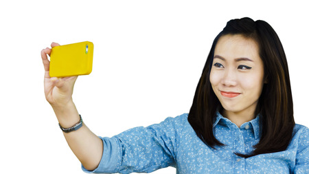 an asian woman is taking selfieの写真素材