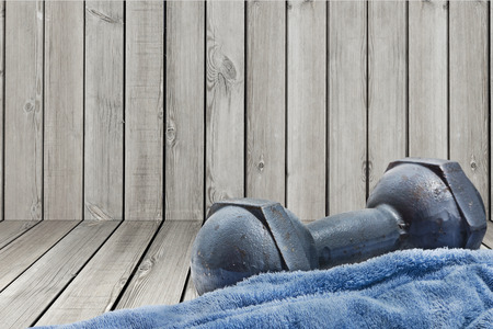 a dumbbell and a towelの写真素材