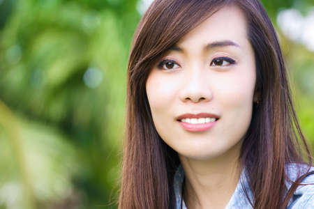 an asian woman is smilingの写真素材
