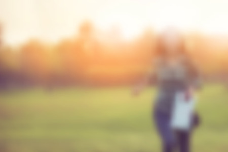 blur background of an asian woman is runningの写真素材