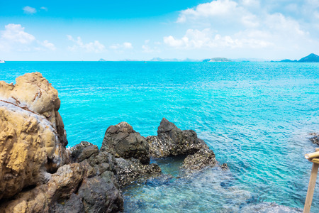rocks on the beach with sea and sky in summerの写真素材
