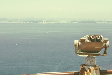 a telescope on the hill for seeing across the Tokyo bayの写真素材
