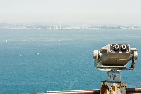 a telescope on the hill for seeing across the Tokyo bayの写真素材