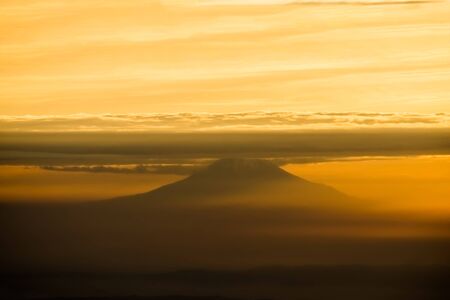 fuji mountain in the evening sky with cloudの写真素材