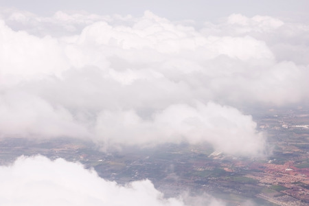 above the cloud in the sky from the planeの写真素材