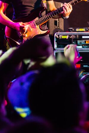 soft focus of a guitarist on stage during concertの写真素材