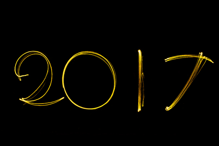 Text font 2017 firework written with Sparkle on black background sign calendar of happy new year