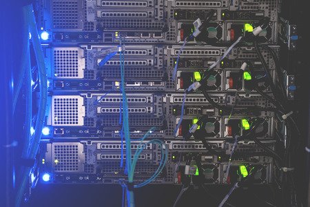 Back panel of powerful servers installed in the rack of the server room of the data center