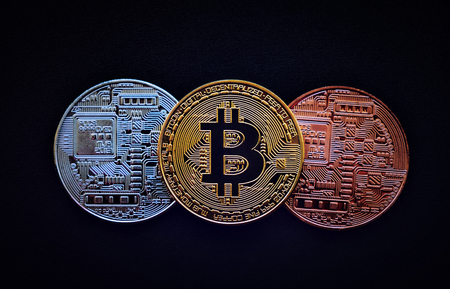 Stack of glod bitcoins with a single coin facing the camera in B sharp focus, Cryptocurrency concept. Virtual currency digital payment systemの写真素材