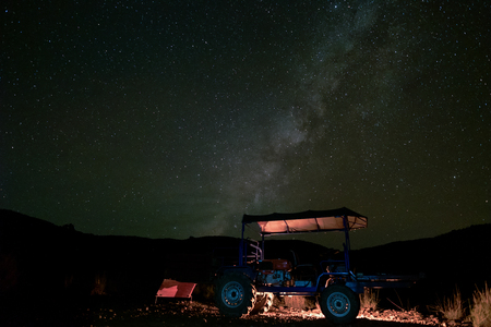Landscape with Milky way and Star at night in countryside with tractor farmer local thailand mountaun backgroundの写真素材