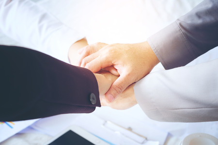 Business men making handshake, Partnership congratulation, merger and acquisition concepts, Vintage...