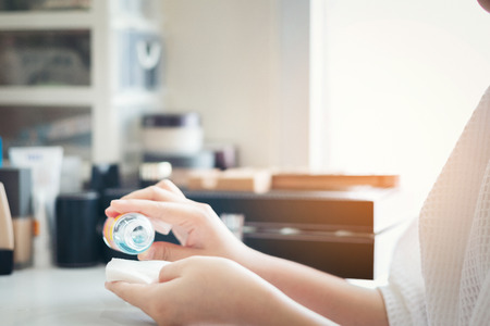 Beautiful woman hands Skin Care. Close Up Of Female Hands Holding Cream Tube, Beautiful Woman Hands With Natural Manicure Nails Applying Cosmetic Hand Cream On Soft Silky Healthy Skin. Beauty And Body Care Conceptの写真素材