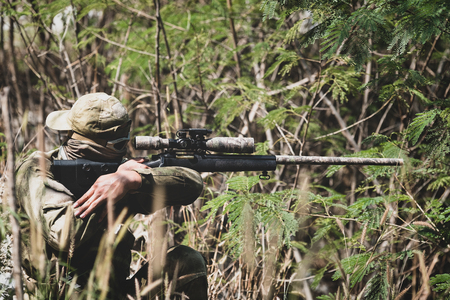 Fully Equipped Soldiers Wearing Camouflage Uniform Attacking Enemy, Airsoft military game player in camouflage uniformの写真素材