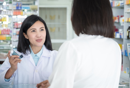 Doctor test and teach spray and checking for a patient's mouthの写真素材