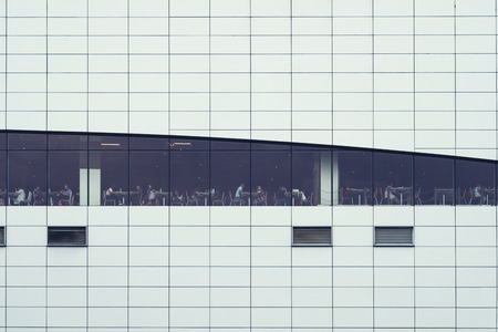 PATTAYA, THAILAND - June 22, 2019: people sitting in canteen supperstore building. Windows interior. Concept for employment, business, corporate, relax, business people, modern life, busy people, Modern building backgroundのeditorial素材