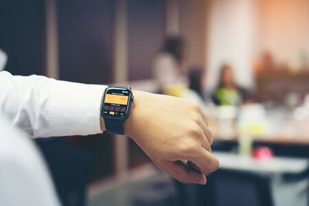 Bangkok Thailand - DEC 19, 2019: Man hand with Apple Watch Series 4 with PM 2.5 on the screen in...