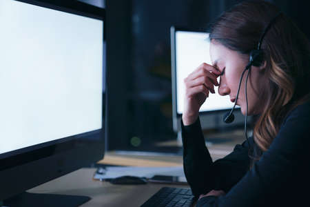 Thai asian women call center business people get headache and migraine from working late night shift...