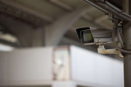 Security IR camera for monitor events in city, operating inside the building with copy space....