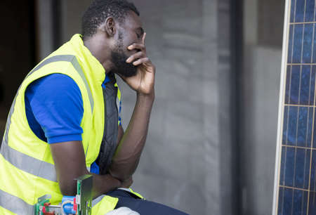 Engineer or architect holding hands at his head. He is having problems in work. Engineering concept.