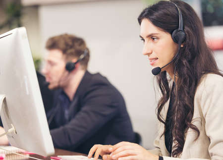 Multi-Cultural Business People Working In A Call Center, Online customer care support service.
