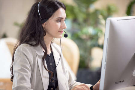 Multi-Cultural Business People Working In A Call Center, Online customer care support service.