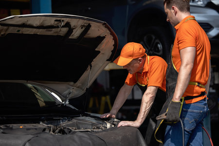Repair Man Worker Polishing Automobile Car Body In Garageの写真素材
