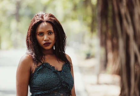 Happiest outside in the garden, carefree young black womanの写真素材