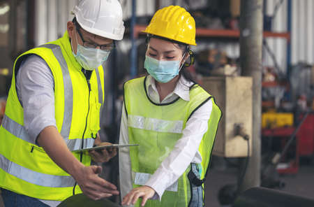Engineers in steel factory working on digital tablet, Quality control management.の写真素材