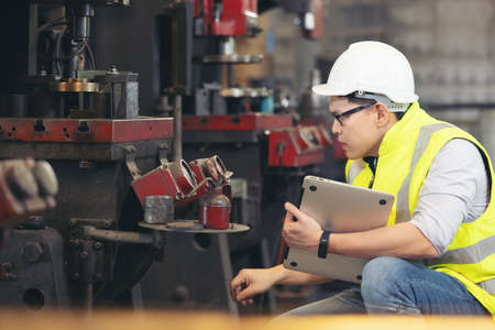 engineer man, or technicians wearing surgical mask and using computer notebook for Checking