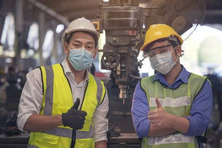 Young skillful factory worker or engineer close up portrait in factory
