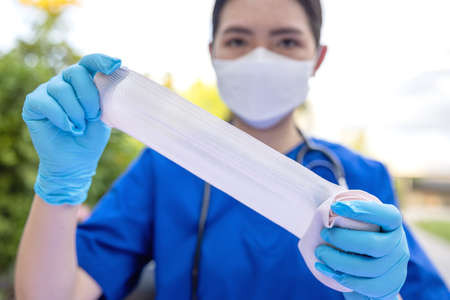 Women asia doctor show medical bandage in hands