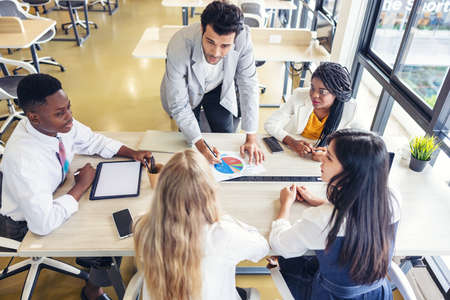 Selective focus of Multi-ethnic group of young people studying togetherの写真素材