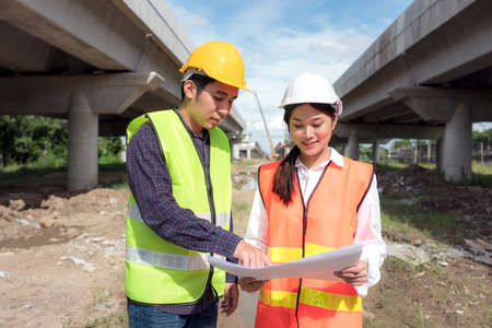 In the background, skyscraper concrete formwork frames, and a portrait of a confident female...